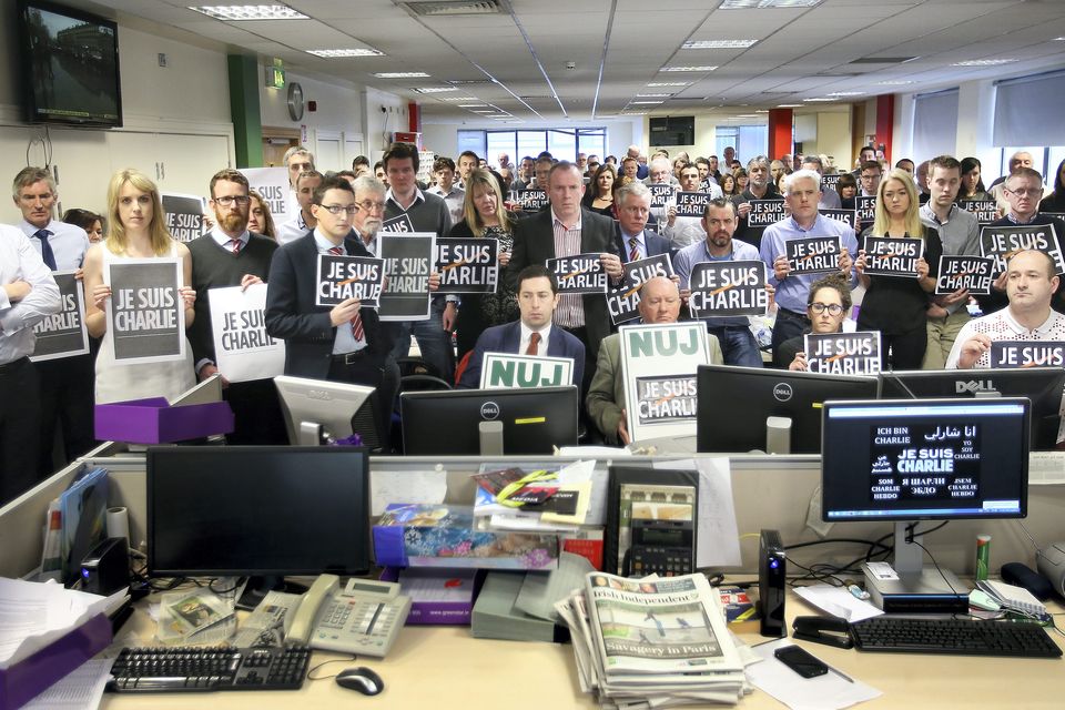 Members of the NUJ and Staff from all the Titles at Independent News and Media pictured in the Irish Independent Newsroom during the minute silence for the victims of the Charlie Hebdo attack in Paris