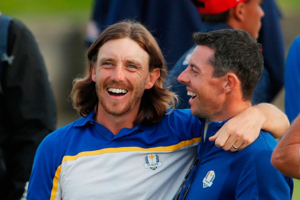 Golf - 2018 Ryder Cup at Le Golf National - Guyancourt, France - September 30, 2018 - Team Europe's Rory McIlroy celebrates with Tommy Fleetwood after winning the Ryder Cup