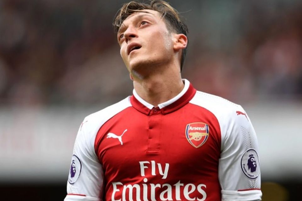 Mesut Ozil has often cut a forlorn figure this season CREDIT: GETTY IMAGES