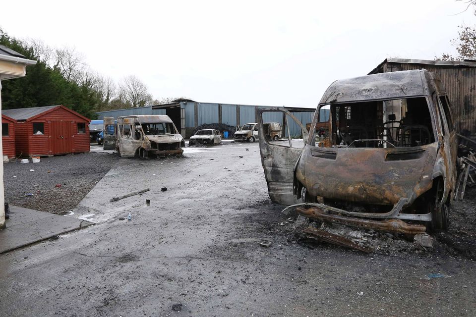 Some of the burned out vans and cars in the yard of the house which was the scene of an eviction in Strokestown last week. 
Photo Brian Farrell
