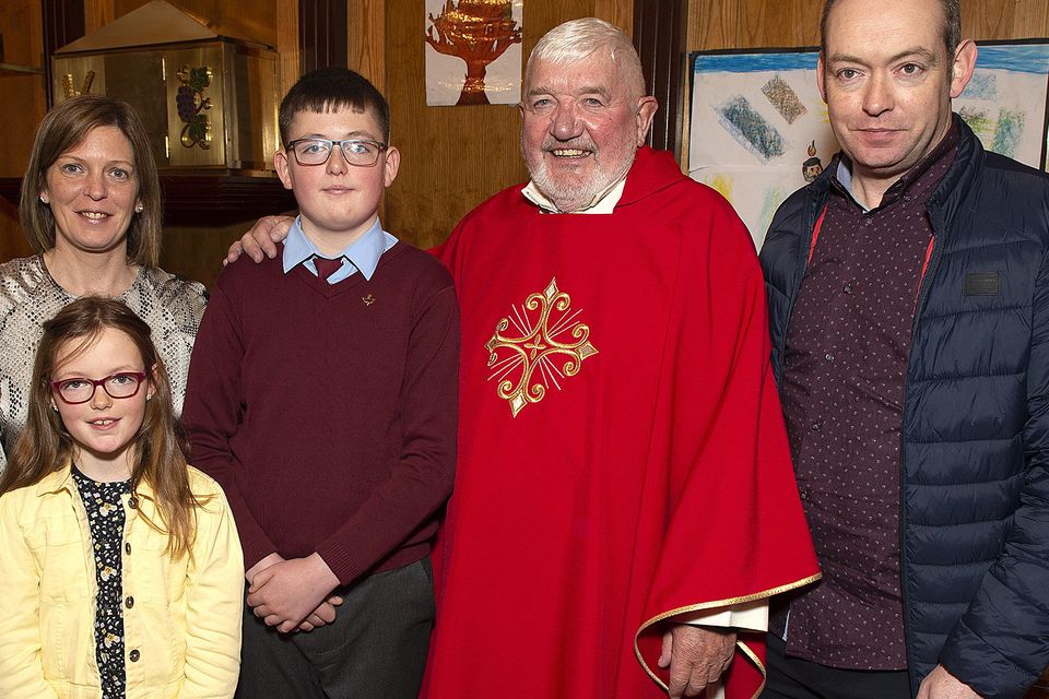 Eoin Cowman with Mary, Aoife and Brian Cowman and the V Rev. Joseph Power PP.