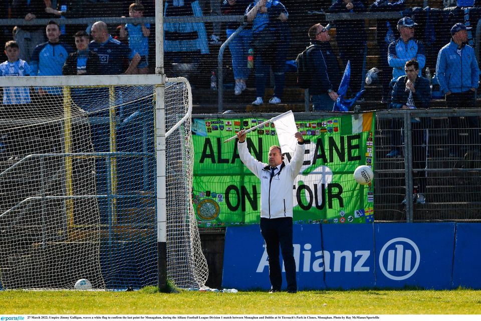 Umpire Jimmy Galligan, waves a white flag to confirm the last point and win for Monagahan over Dublin at St Tiernach's Park in Clones. Photo by Ray McManus/Sportsfile