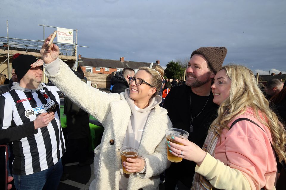 Brian McFadden takes a picture with Chorley fans (Nigel French/PA)