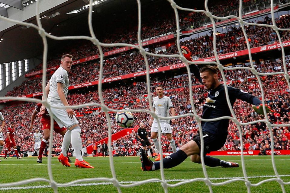 Manchester United's Phil Jones watches as David De Gea makes a brilliant save