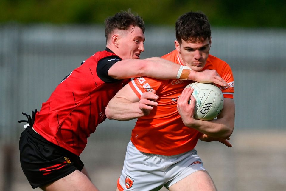 Jarlath Óg Burns of Armagh is tackled by Ryan McEvoy of Down at St Tiernach's Park in Clones, Monaghan. Photo by Stephen McCarthy/Sportsfile