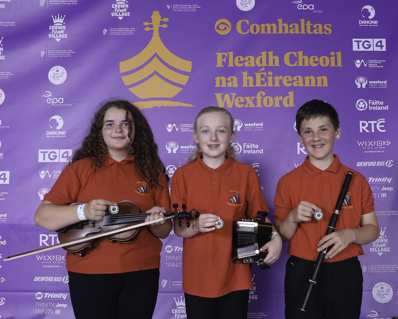 Éibhin O'Dwyer (Concertina), Robert Moran (Flute), Sophie Bennett (Fiddle) of CCÉ, Bannow, Loch Garman, 3rd Place All Ireland Winner of the Deirdre Rooney Memorial Cup (under 12 years) at the 2024 Comhaltas Ceoltóirí Éireann All Ireland Fleadh Cheoil in Wexford. Photo: Anna Allen Photography Mullingar  
