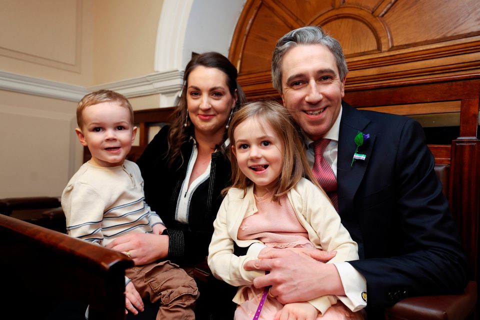 Taoiseach Simon Harris with his wife Caoimhe and children Cillian and Saoirse in the Dáil chamber. Photo: Maxwells