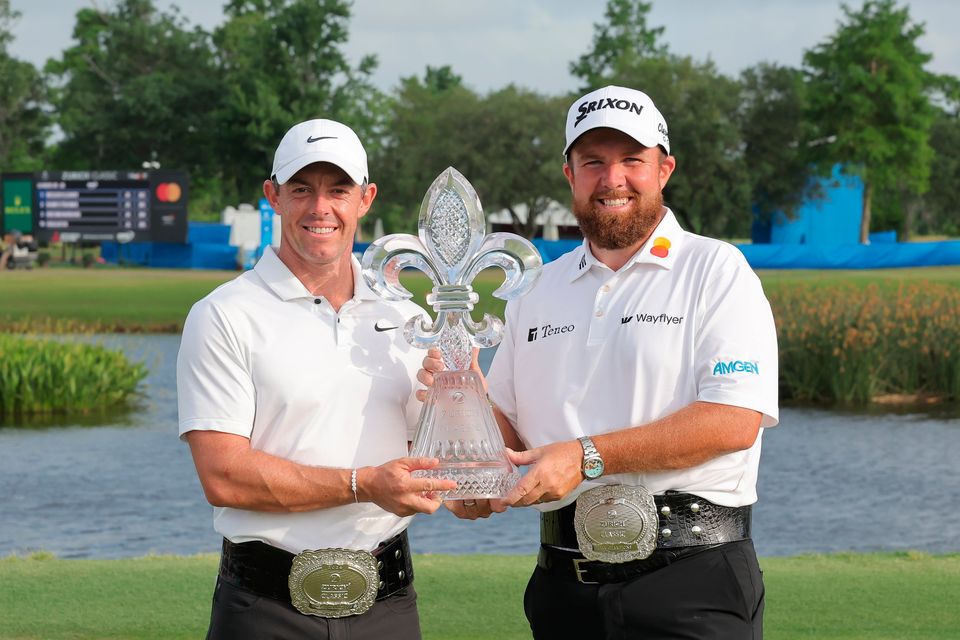 Rory McIlroy and Shane Lowry pose with the trophy after the final round of the Zurich Classic of New Orleans at TPC Louisiana. (Photo by Jonathan Bachman/Getty Images)