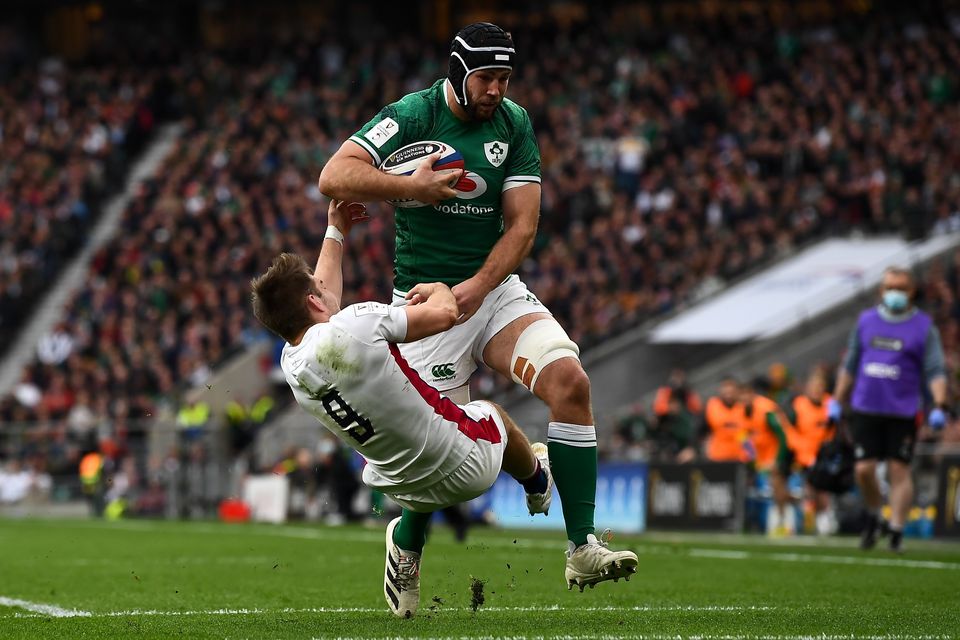Caelan Doris powers through the tackle of England's Harry Randall during the 2022 Six Nations clash at Twickenham. Photo: David Fitzgerald/Sportsfile