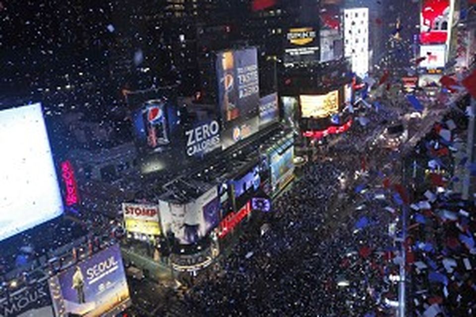 Confetti flies over New York's Times Square during the New Year's Eve celebration (AP)