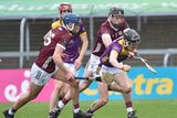 thumbnail: Wexford defender Cathal Sinnott under pressure as he tries to clear his lines. Photo: Jim Campbell