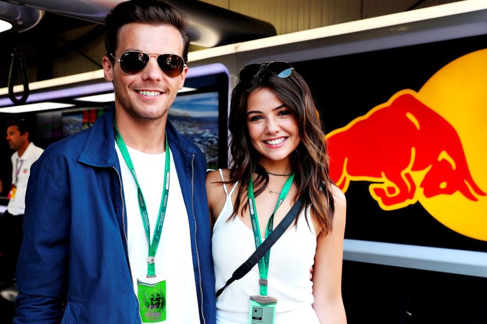 Louis Tomlinson, singer, with girlfriend Danielle Campbell at the Red Bull Racing garage during qualifying for the Monaco Formula One Grand Prix at Circuit de Monaco on May 28, 2016 in Monte-Carlo, Monaco.  (Photo by Mark Thompson/Getty Images)