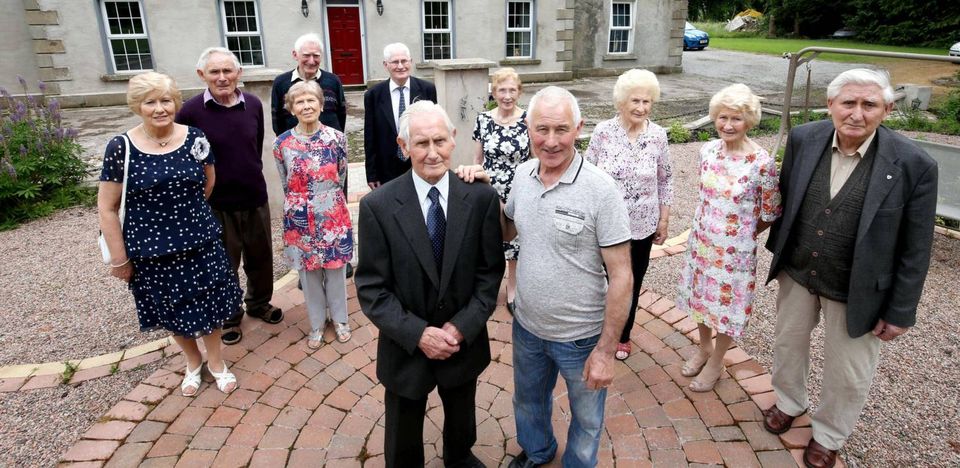 From left to right: Kathleen (74), Seamus (79), Terry (80), Rose (84), Tony (82), Sean (92), Mairead (85), Leo (70), Eileen (89), Maureen (91), Peter (86) with Paul Muldoon who narrated the first documentary